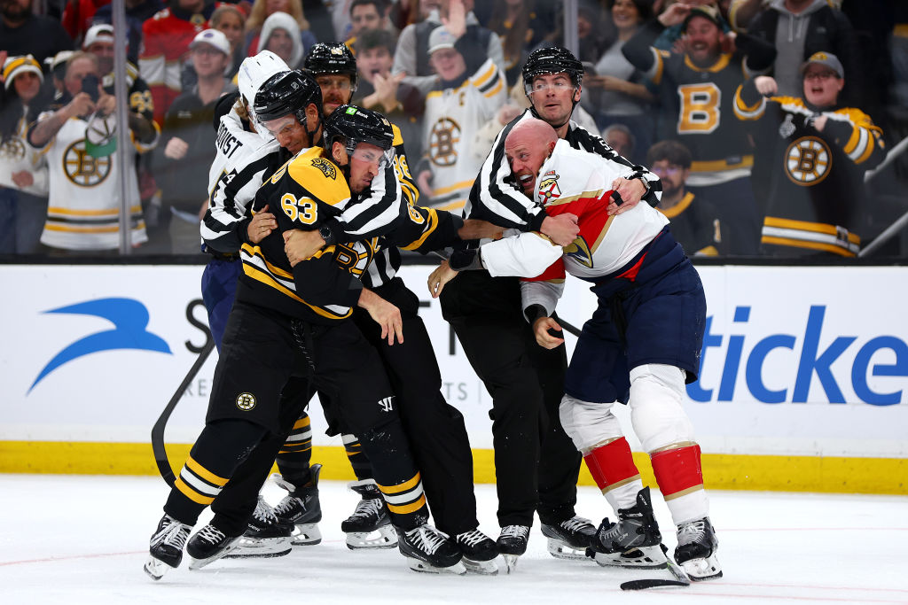 BOSTON, MASSACHUSETTS - OCTOBER 14: Brad Marchand #63 of the Boston Bruins fights with Nate Schmidt #88 of the Florida Panthers during the first period at TD Garden on October 14, 2024 in Boston, Massachusetts. (Photo by Maddie Meyer/Getty Images)