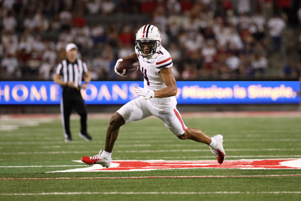 TUCSON, ARIZONA - AUGUST 31: Wide receiver Tetairoa McMillan #4 of the Arizona Wildcats runs during the second half against the New Mexico Lobos at Arizona Stadium on August 31, 2024 in Tucson, Arizona. McMillan has set the program single game receiving record. (Photo by Chris Coduto/Getty Images)