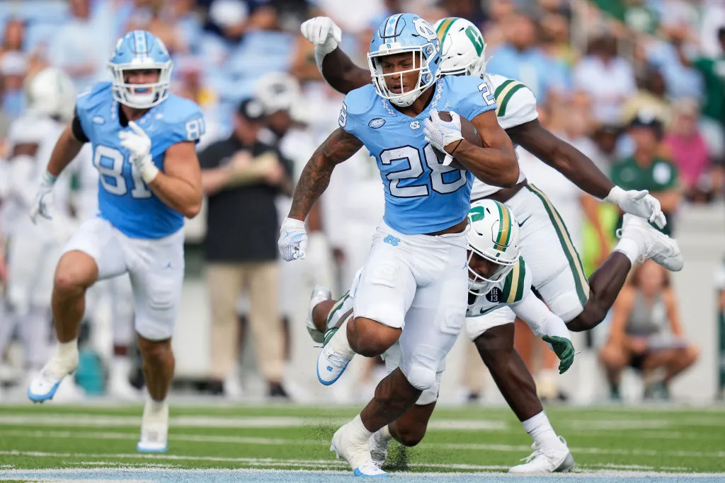 CHAPEL HILL, NORTH CAROLINA - SEPTEMBER 07: Omarion Hampton #28 of the North Carolina Tar Heels runs against the Charlotte 49ers during the first half of their game at Kenan Memorial Stadium on September 07, 2024 in Chapel Hill, North Carolina. (Photo by Grant Halverson/Getty Images)