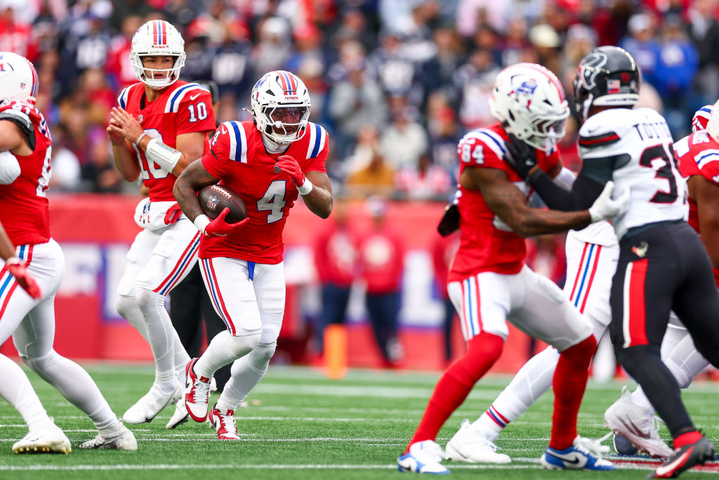 FOXBOROUGH, MASSACHUSETTS - OCTOBER 13: Antonio Gibson #4 of the New England Patriots carries the ball against the Houston Texans during the first half of the game at Gillette Stadium on October 13, 2024 in Foxborough, Massachusetts. (Photo by Maddie Meyer/Getty Images)