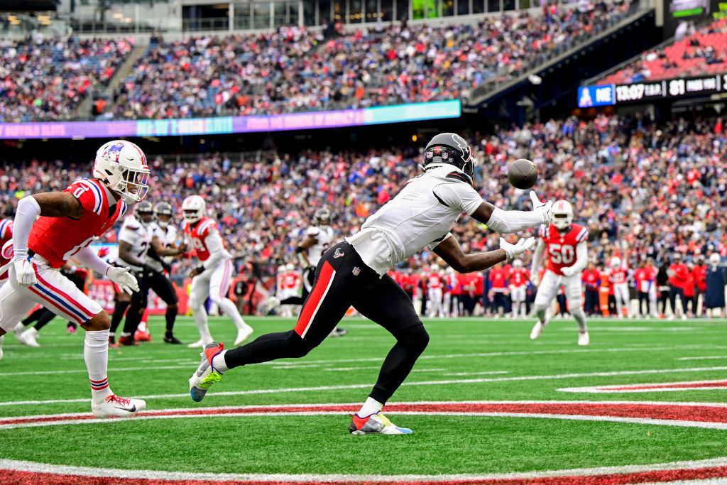 FOXBOROUGH, MASSACHUSETTS - OCTOBER 13: Stefon Diggs #1 of the Houston Texans catches a pass for a touchdown against the New England Patriots during the third quarter of the game at Gillette Stadium on October 13, 2024 in Foxborough, Massachusetts. (Photo by Maddie Malhotra/Getty Images)