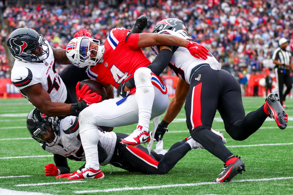 FOXBOROUGH, MASSACHUSETTS - OCTOBER 13: Antonio Gibson #4 of the New England Patriots carries the ball against the Houston Texans during the second half at Gillette Stadium on October 13, 2024 in Foxborough, Massachusetts. (Photo by Maddie Meyer/Getty Images)