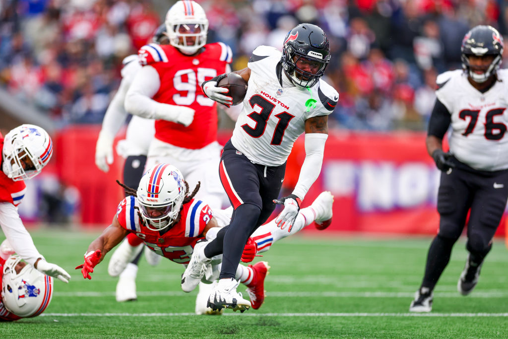 FOXBOROUGH, MASSACHUSETTS - OCTOBER 13: Dameon Pierce #31 of the Houston Texans carries the ball for a touchdown against the New England Patriots during the fourth quarter at Gillette Stadium on October 13, 2024 in Foxborough, Massachusetts. (Photo by Maddie Meyer/Getty Images)