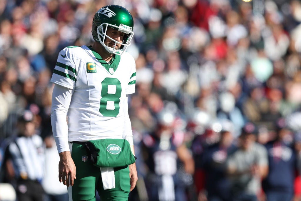 FOXBOROUGH, MASSACHUSETTS - OCTOBER 27: Aaron Rodgers #8 of the New York Jets looks on during the second quarter against the New England Patriots at Gillette Stadium on October 27, 2024 in Foxborough, Massachusetts. (Photo by Adam Glanzman/Getty Images)