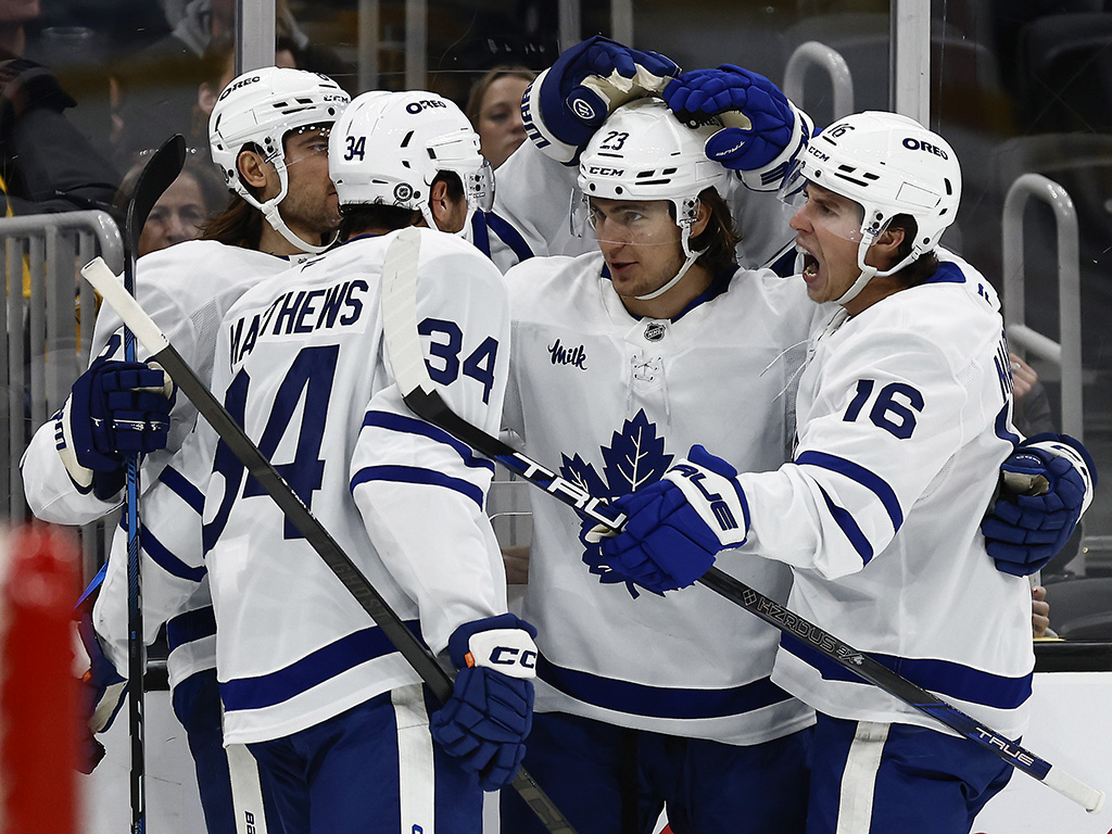 Oct 26, 2024; Boston, Massachusetts, USA; Toronto Maple Leafs left wing Matthew Knies (23) is congratulated by right wing Mitch Marner (16) and center Auston Matthews (34) after his goal against the Boston Bruins during the second period at TD Garden. Mandatory Credit: Winslow Townson-Imagn Images