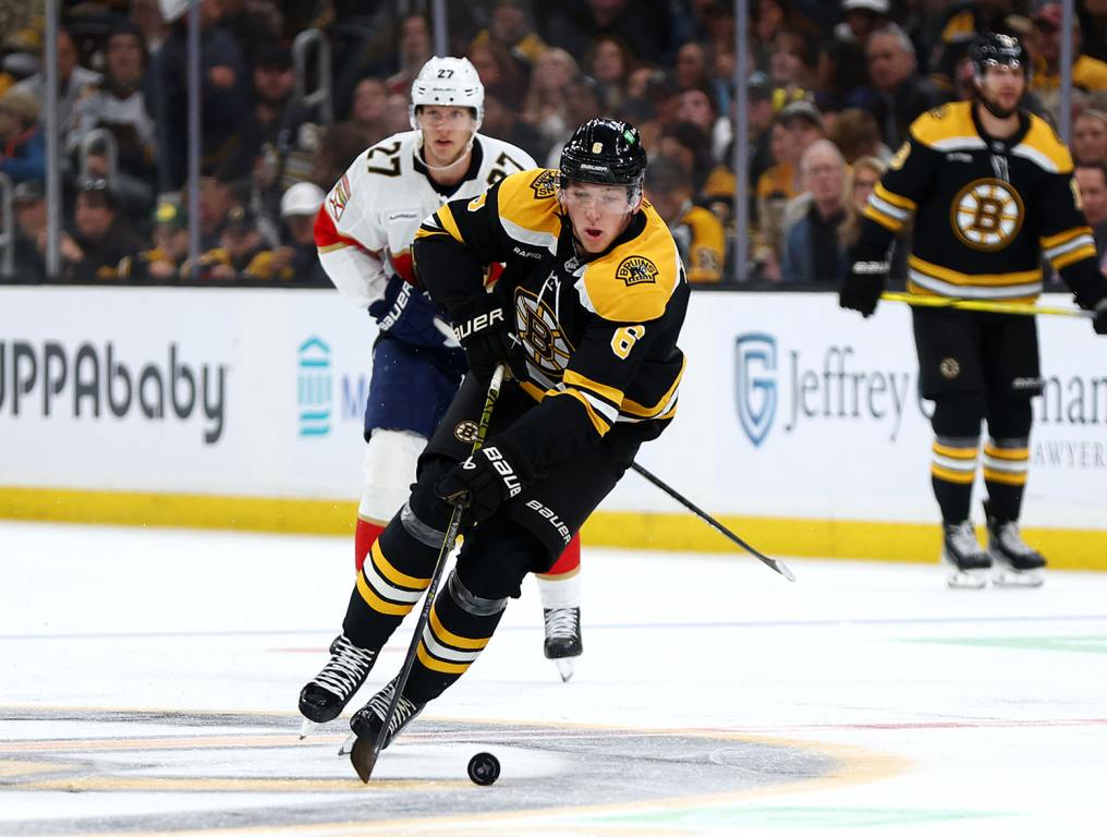 BOSTON, MASSACHUSETTS - OCTOBER 14: Mason Lohrei #6 of the Boston Bruins skates against Eetu Luostarinen #27 of the Florida Panthers during the third period at TD Garden on October 14, 2024 in Boston, Massachusetts. The Panthers defeat the Bruins 4-3. (Photo by Maddie Meyer/Getty Images)