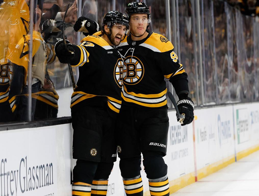 BOSTON, MASSACHUSETTS - OCTOBER 10: Mark Kastelic #47 of the Boston Bruins celebrates his goal against the Montreal Canadiens with teammate Nikita Zadorov #91 during the first period at the TD Garden on October 10, 2024 in Boston, Massachusetts. (Photo by Rich Gagnon/Getty Images)