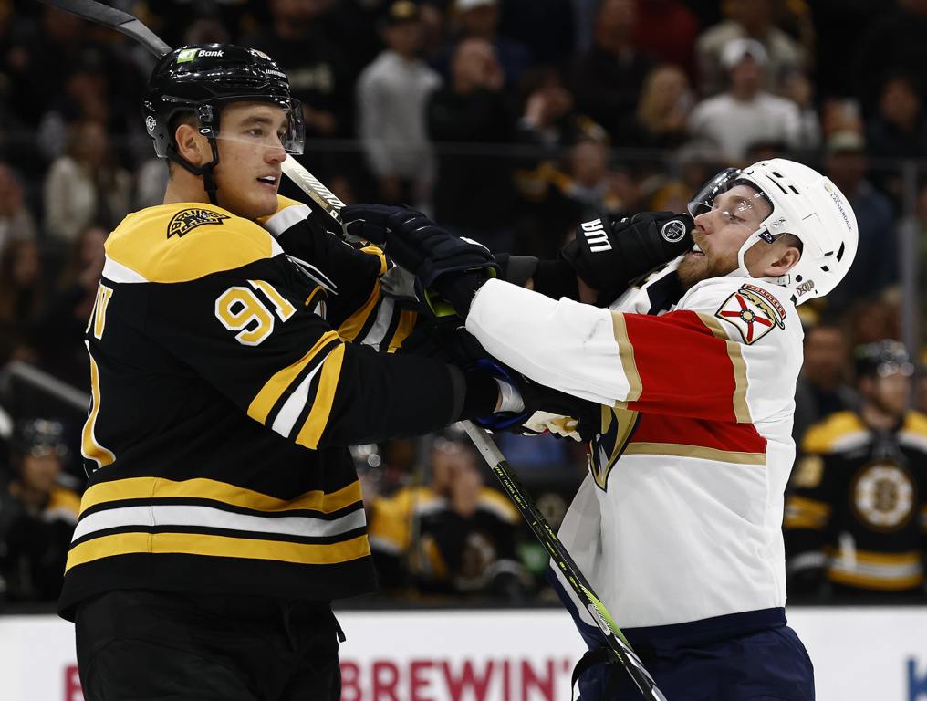 Oct 14, 2024; Boston, Massachusetts, USA; Boston Bruins defenseman Nikita Zadorov (91) mixes it up with Florida Panthers center Sam Bennett (9) during the first period at TD Garden. Mandatory Credit: Winslow Townson-Imagn Images