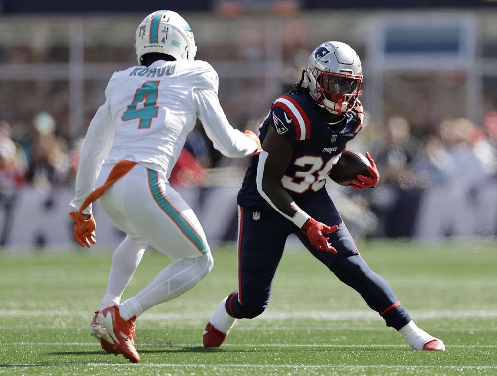 FOXBOROUGH, MASSACHUSETTS - OCTOBER 06: Rhamondre Stevenson #38 of the New England Patriots runs with the ball during the first quarter against the Miami Dolphins at Gillette Stadium on October 06, 2024 in Foxborough, Massachusetts. (Photo by Adam Hunger/Getty Images)