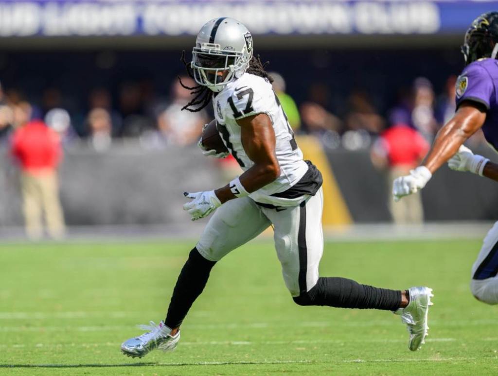 Sep 15, 2024; Baltimore, Maryland, USA; Las Vegas Raiders wide receiver Davante Adams (17) runs with the ball as Baltimore Ravens cornerback Marlon Humphrey (44) defends during the second half at M&T Bank Stadium. Credit: Reggie Hildred-Imagn Images