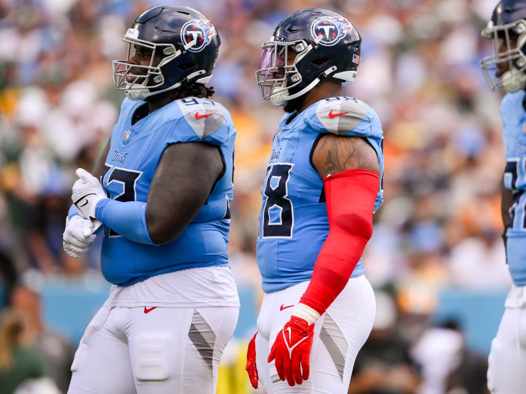 Sep 22, 2024; Nashville, Tennessee, USA; Tennessee Titans defensive tackle T'Vondre Sweat (93), defensive tackle Jeffery Simmons (98), linebacker Jaylen Harrell (92) waits for the offense to come to the line against the Green Bay Packers during the first half at Nissan Stadium. Credit: Steve Roberts-Imagn Images