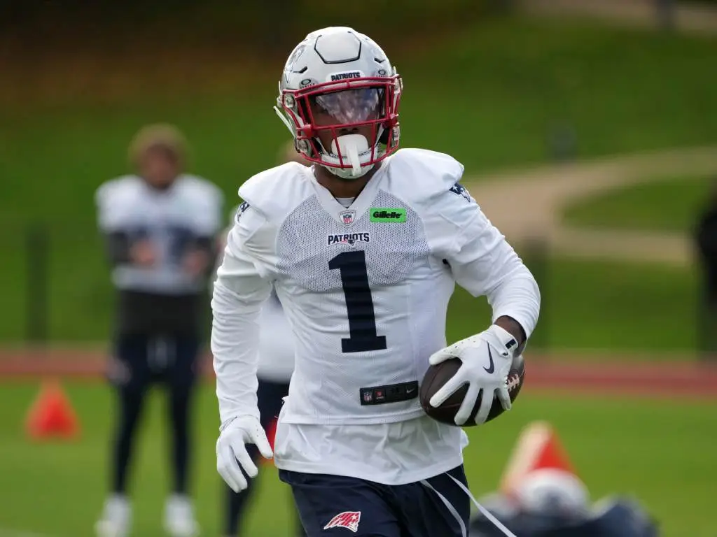 Oct 18, 2024; London, United Kingdom; New England Patriots wide receiver Ja'Lynn Polk (1) carries the ball during practice at the Harrow School. Credit: Kirby Lee-Imagn Images