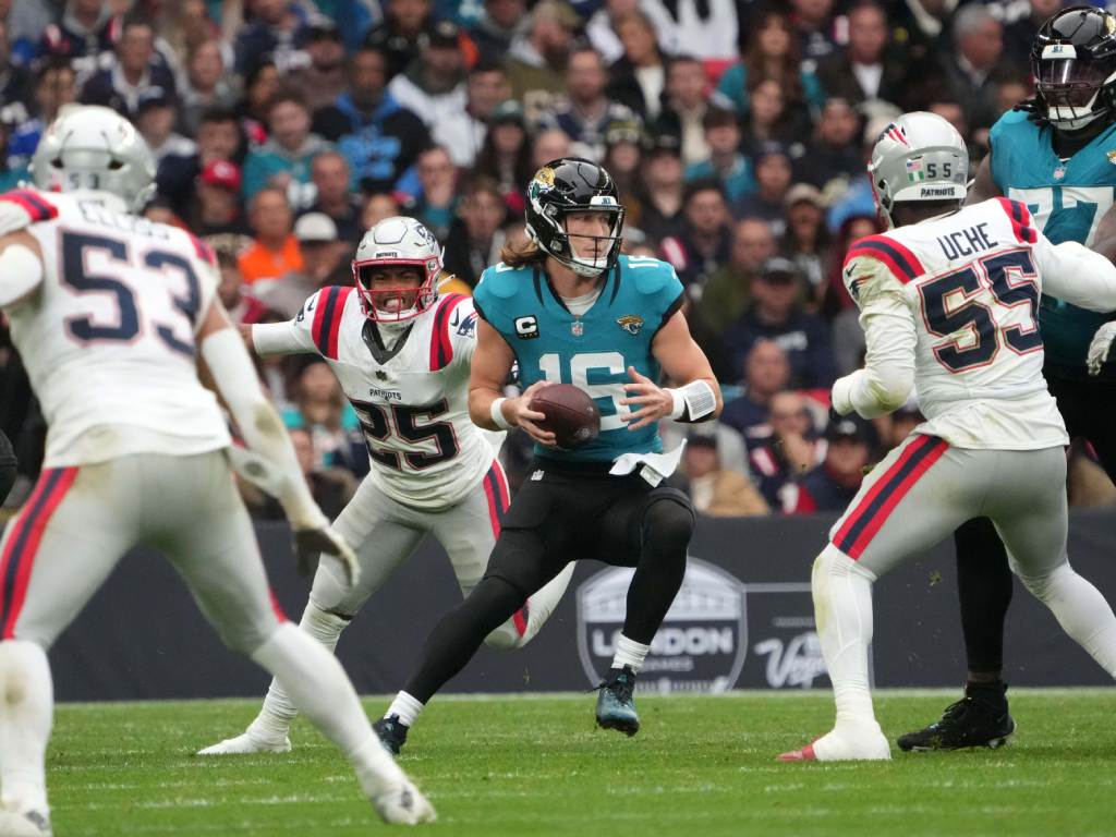 Oct 20, 2024; London, United Kingdom; Jacksonville Jaguars quarterback Trevor Lawrence (16) prepares to throw the ball against the New England Patriots in the second half of an NFL International Series game at Wembley Stadium. Credit: Kirby Lee-Imagn Images