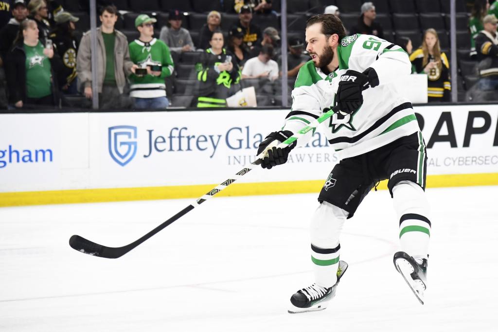 Oct 24, 2024; Boston, Massachusetts, USA;  Dallas Stars center Tyler Seguin (91) shoots the puck during warmups prior to a game against the Boston Bruins at TD Garden. Mandatory Credit: Bob DeChiara-Imagn Images