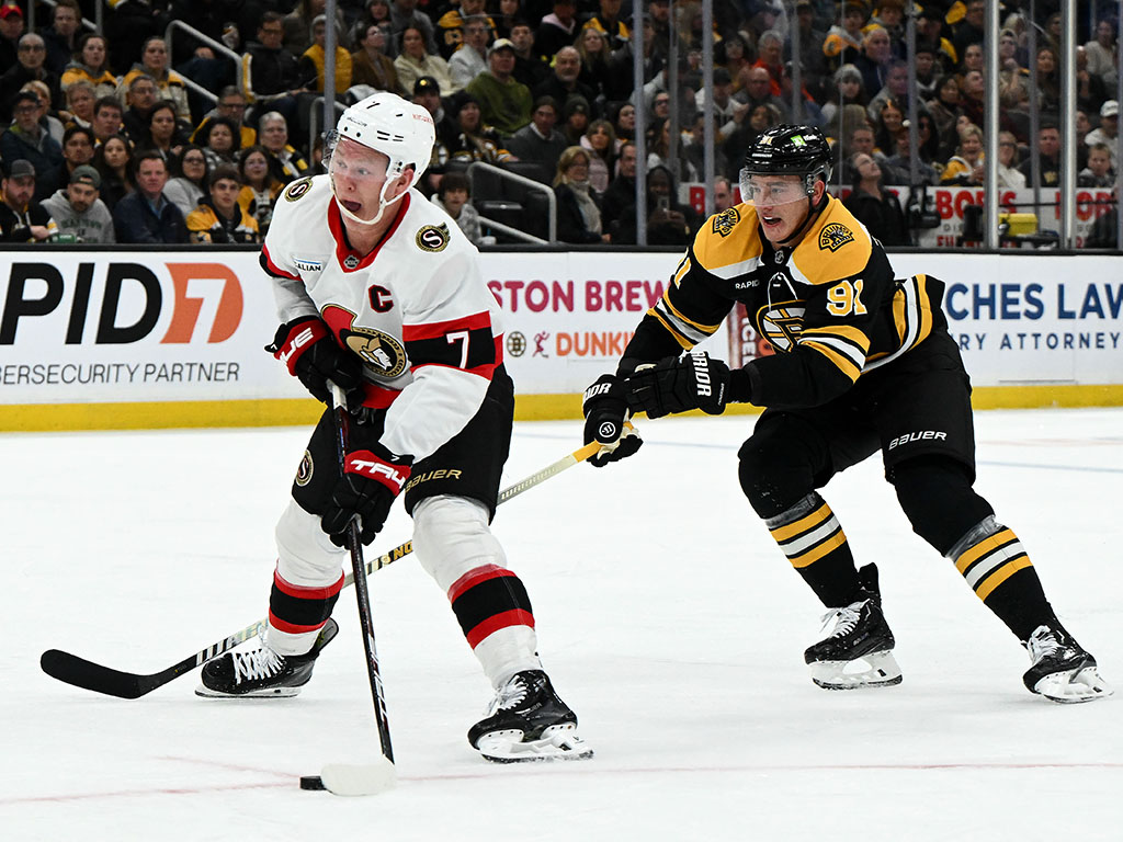 Nov 9, 2024; Boston, Massachusetts, USA; Ottawa Senators left wing Brady Tkachuk (7) skates against Boston Bruins defenseman Nikita Zadorov (91) during the second period at TD Garden. Mandatory Credit: Brian Fluharty-Imagn Images