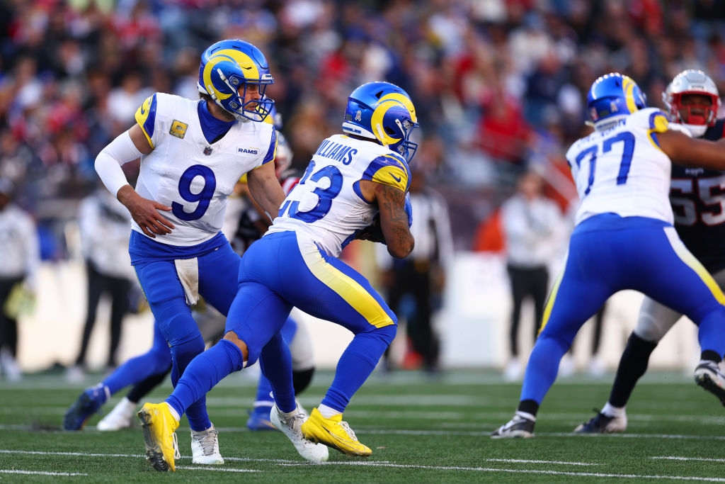 FOXBOROUGH, MASSACHUSETTS - NOVEMBER 17: Quarterback Matthew Stafford #9 hands the ball off to Kyren Williams #23 of the Los Angeles Rams during the second quarter against the New England Patriots at Gillette Stadium on November 17, 2024 in Foxborough, Massachusetts. (Photo by Maddie Meyer/Getty Images)