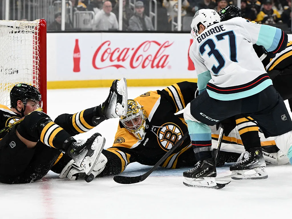 Nov 3, 2024; Boston, Massachusetts, USA; Boston Bruins goaltender Jeremy Swayman (1) makes a save on a shot made by Seattle Kraken center Yanni Gourde (37) during the second period at the TD Garden. Mandatory Credit: Brian Fluharty-Imagn Images