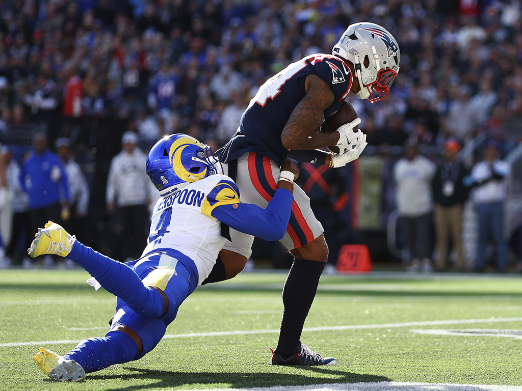 FOXBOROUGH, MASSACHUSETTS - NOVEMBER 17: Kendrick Bourne #84 of the New England Patriots scores a first quarter touchdown as Ahkello Witherspoon #4 of the Los Angeles Rams attempts to make a tackle at Gillette Stadium on November 17, 2024 in Foxborough, Massachusetts. (Photo by Maddie Meyer/Getty Images)