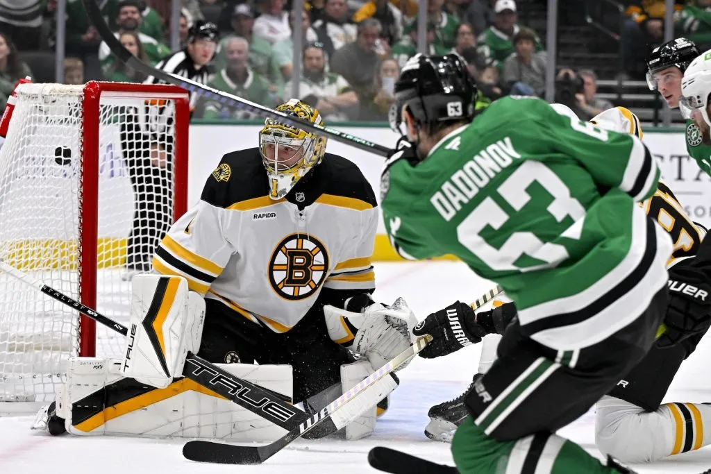 Nov 14, 2024; Dallas, Texas, USA; Dallas Stars right wing Evgenii Dadonov (63) scores a goal against Boston Bruins goaltender Jeremy Swayman (1) during the second period at the American Airlines Center. Mandatory Credit: Jerome Miron-Imagn Images