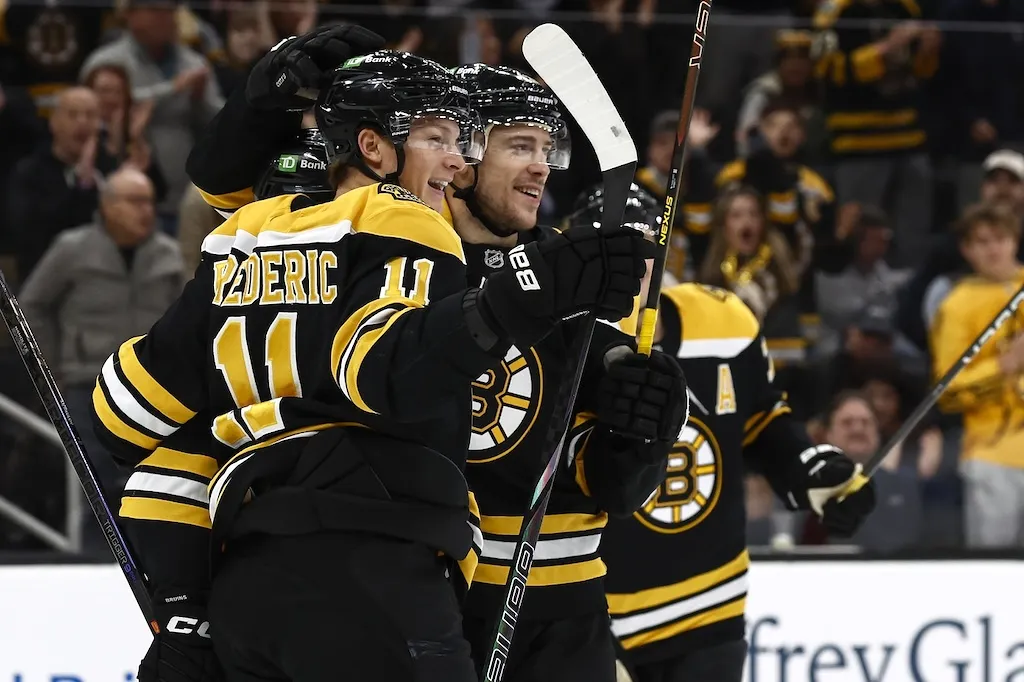 Nov 16, 2024; Boston, Massachusetts, USA; Boston Bruins center Trent Frederic (11) is congratulated by center Charlie Coyle (13) after scoring his second goal against the St. Louis Blues during the first period at TD Garden. Mandatory Credit: Winslow Townson-Imagn Images