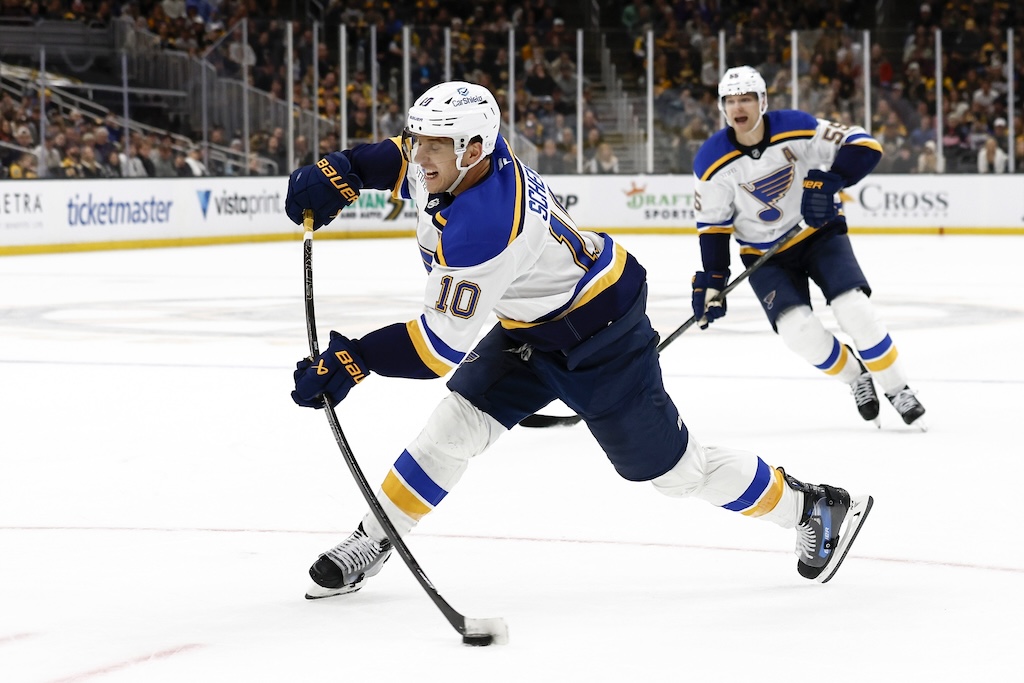 Nov 16, 2024; Boston, Massachusetts, USA; St. Louis Blues center Brayden Schenn (10) lets go with the game winning shot in overtime to give the Blues a 3-2 win over the Boston Bruins at TD Garden. Mandatory Credit: Winslow Townson-Imagn Images