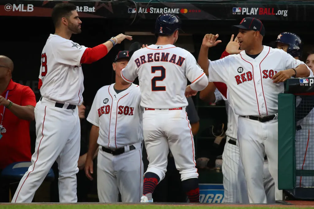 CLEVELAND, OHIO - JULY 09: Manager Alex Cora and J.D. Martinez #28 of the Boston Red Sox react with Alex Bregman #2 of the Houston Astros the 2019 MLB All-Star Game at Progressive Field on July 09, 2019 in Cleveland, Ohio. (Photo by Gregory Shamus/Getty Images)