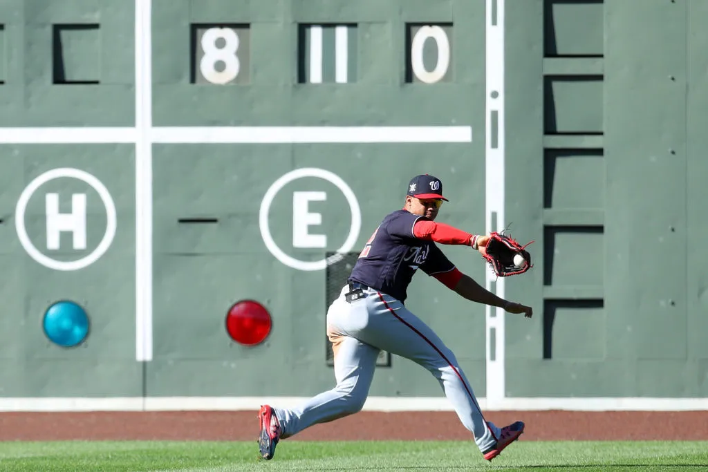 BOSTON, MASSACHUSETTS - AUGUST 30: Juan Soto #42 of the Washington Nationals collects a single hit by Rafael Devers #42 of the Boston Red Sox during the sixth inning at Fenway Park on August 30, 2020 in Boston, Massachusetts. All players are wearing #42 in honor of Jackie Robinson Day. The day honoring Jackie Robinson, traditionally held on April 15, was rescheduled due to the COVID-19 pandemic. (Photo by Maddie Meyer/Getty Images)