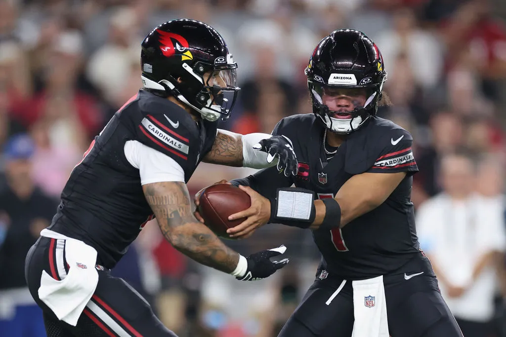 GLENDALE, ARIZONA - OCTOBER 21: Quarterback Kyler Murray #1 of the Arizona Cardinals hands off to James Conner #6 during the NFL game against the Los Angeles Chargers at State Farm Stadium on October 21, 2024 in Glendale, Arizona. The Cardinals defeated the Chargers 17-15.  (Photo by Christian Petersen/Getty Images)