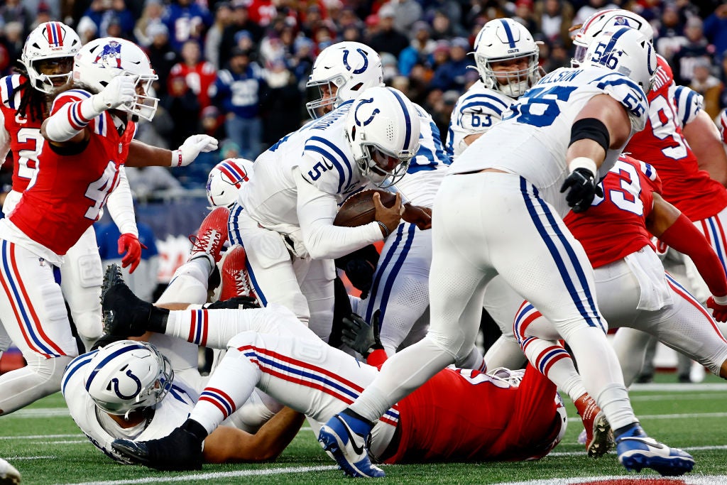 FOXBOROUGH, MASSACHUSETTS - DECEMBER 01: Anthony Richardson #5 of the Indianapolis Colts scores a two point conversion against Christian Elliss #53 and Jabrill Peppers #5 of the New England Patriots during the fourth quarter at Gillette Stadium on December 01, 2024 in Foxborough, Massachusetts. (Photo by Winslow Townson/Getty Images)