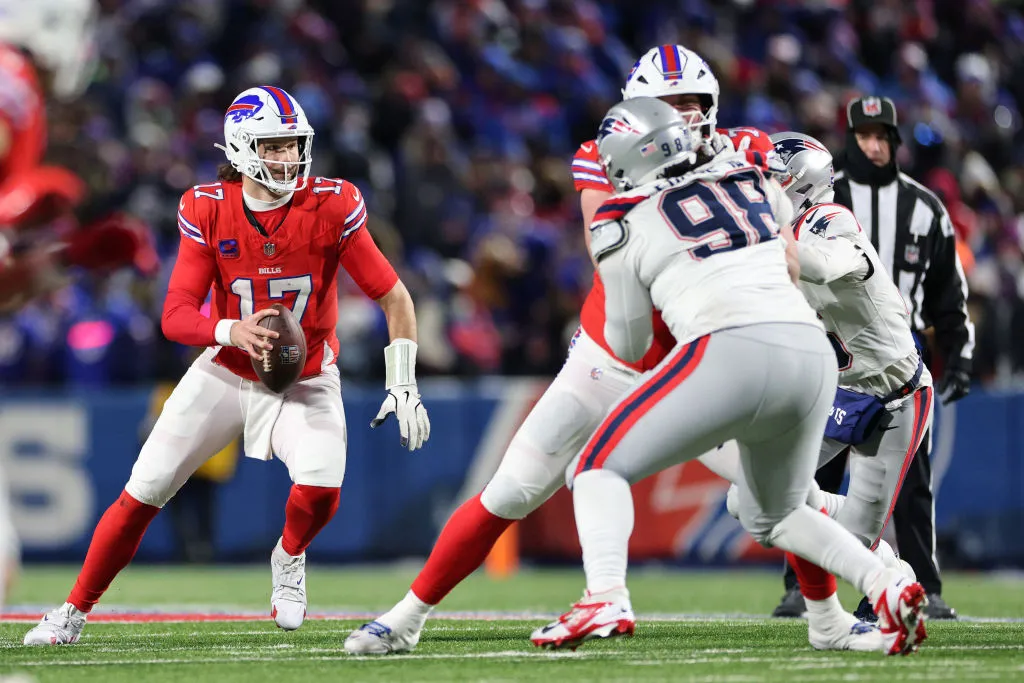 ORCHARD PARK, NEW YORK - DECEMBER 22: Josh Allen #17 of the Buffalo Bills scrambles against the New England Patriots during the third quarter at Highmark Stadium on December 22, 2024 in Orchard Park, New York. (Photo by Bryan M. Bennett/Getty Images)