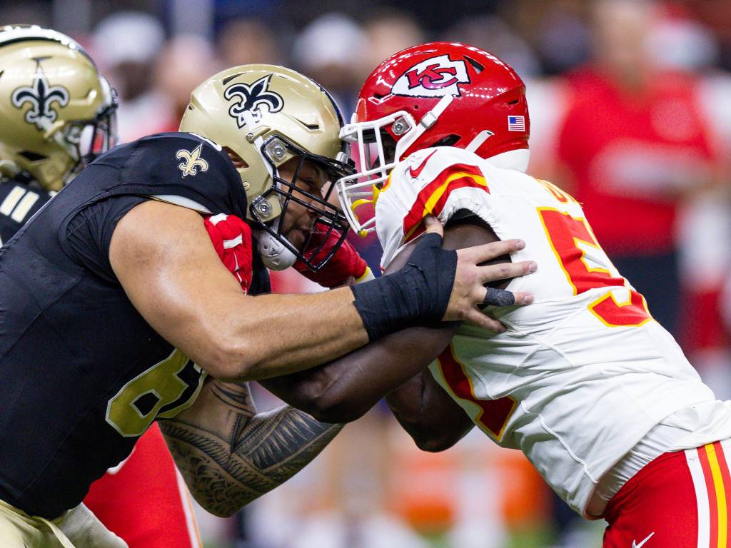 Patriots Aug 13, 2023; New Orleans, Louisiana, USA; New Orleans Saints guard Chuck Filiaga (61) blocks against Kansas City Chiefs defensive end Truman Jones (57) during the second half at the Caesars Superdome. Credit: Stephen Lew-USA TODAY Sports