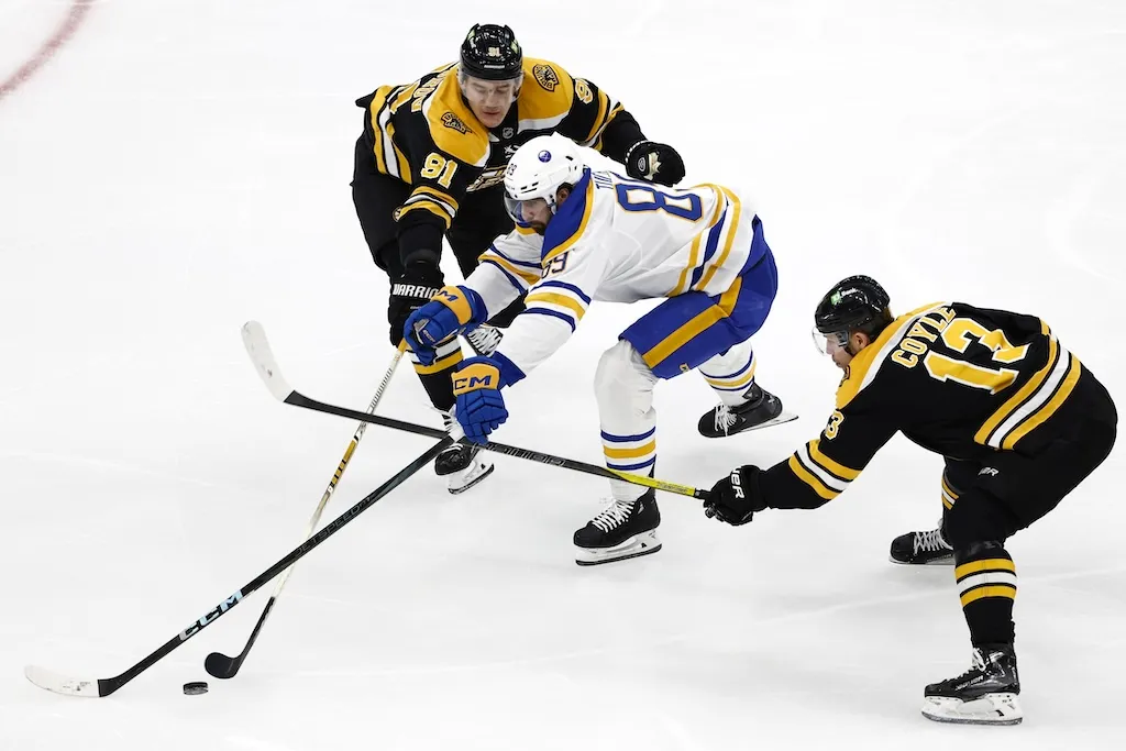 Dec 21, 2024; Boston, Massachusetts, USA; Buffalo Sabres right wing Alex Tuch (89) can’t get between Boston Bruins defenseman Nikita Zadorov (91) and center Charlie Coyle (13) during the third period at TD Garden. Mandatory Credit: Winslow Townson-Imagn Images