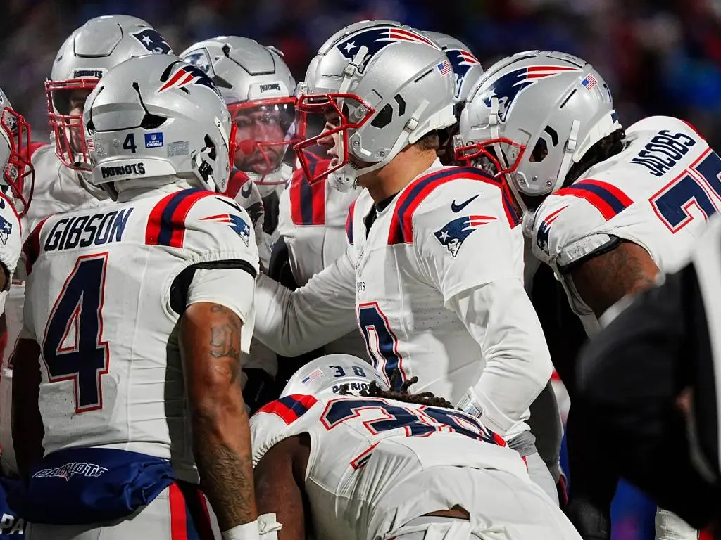 New England Patriots quarterback Drake Maye (10) talks to his offensive line in the huddle during second half action at Highmark Stadium where the Buffalo Bills hosted the New England Patriots in Orchard Park on Dec. 22, 2024. (Tina MacIntyre-Yee/Democrat and Chronicle/USA Today Network via Imagn Images)